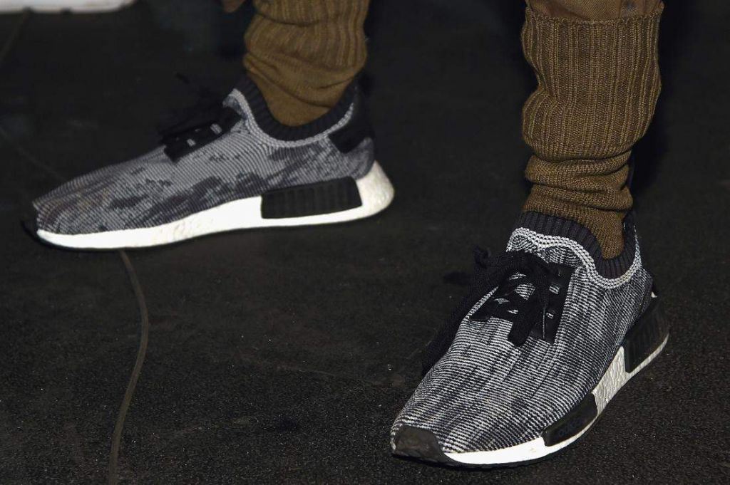 NEW YORK, NY - FEBRUARY 11: Models, show detail, pose wearing Addidas Yeezy Boost sneakers during Kanye West Yeezy Season 3 on February 11, 2016 in New York City. (Photo by Dimitrios Kambouris/Getty Images for Yeezy Season 3)